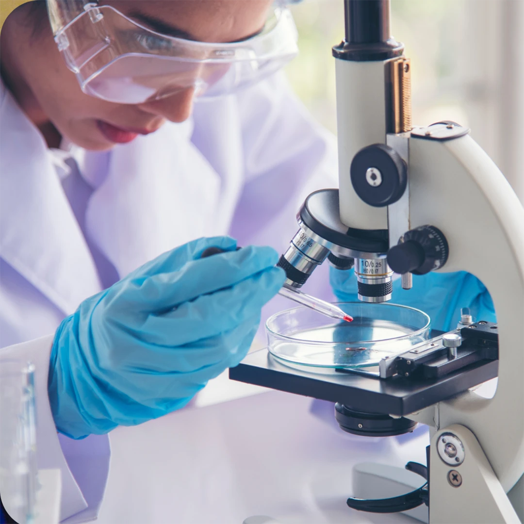 sciences performing experiment under microscope image